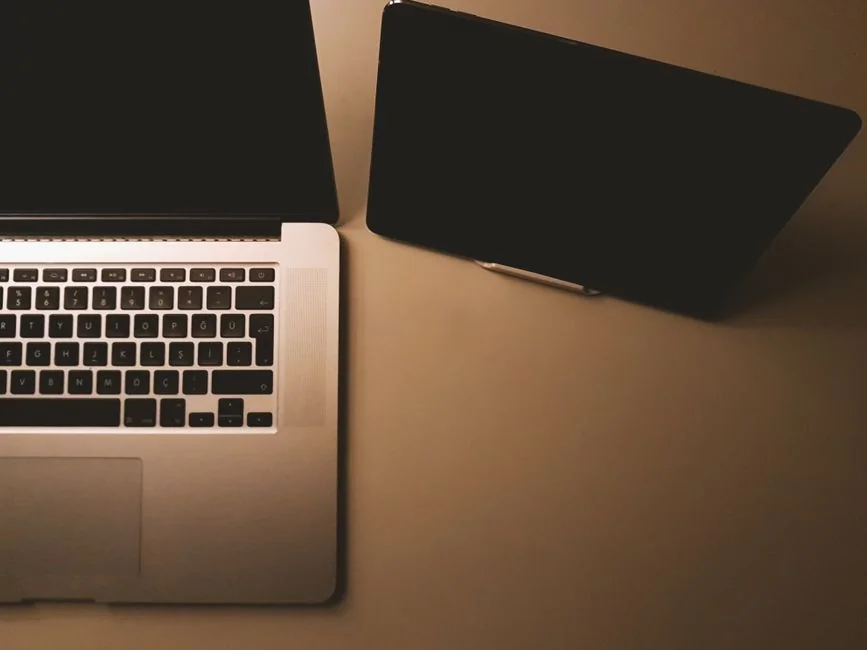 A modern workspace featuring a laptop, tablet, and smartphones, well suited for tech projects and freelance work.